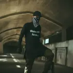 Man wearing a black t-shirt with the phrase 'Wake up, Neo...' – NEO-inspired crypto streetwear design