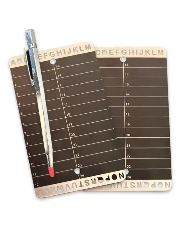 2 Steel seed phrase backup plate with engraved A–Z and 1–24 grid – shown next to engraving tool